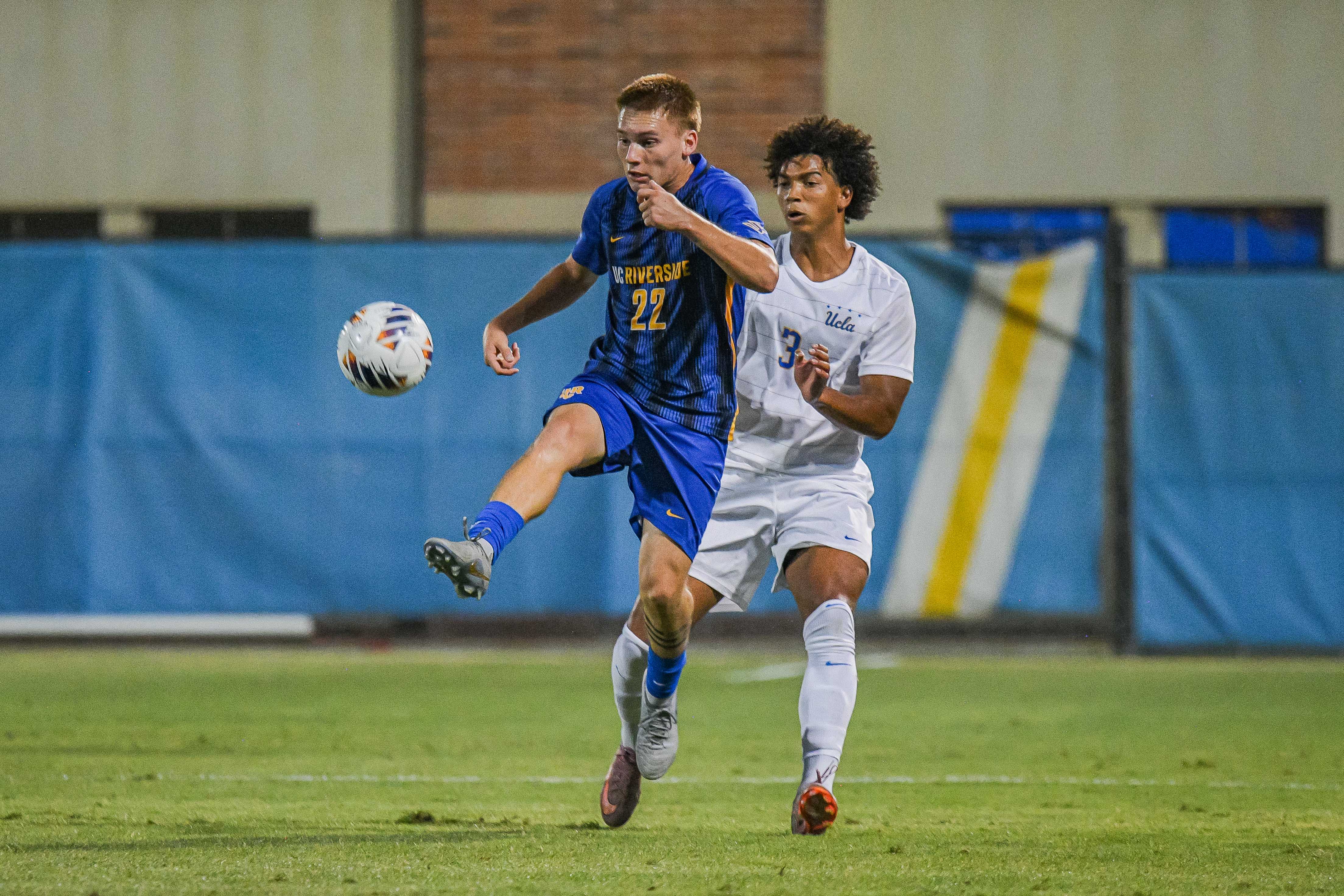 Senior defender Tre Wright plays behind UC Riverside right back Roman Rodriguez in an exhibition match at Wallis Annenberg Stadium. Wright started in 18 games last season and is competing in his fourth season as a Bruin. (Kai Dizon/Assistant Photo editor)