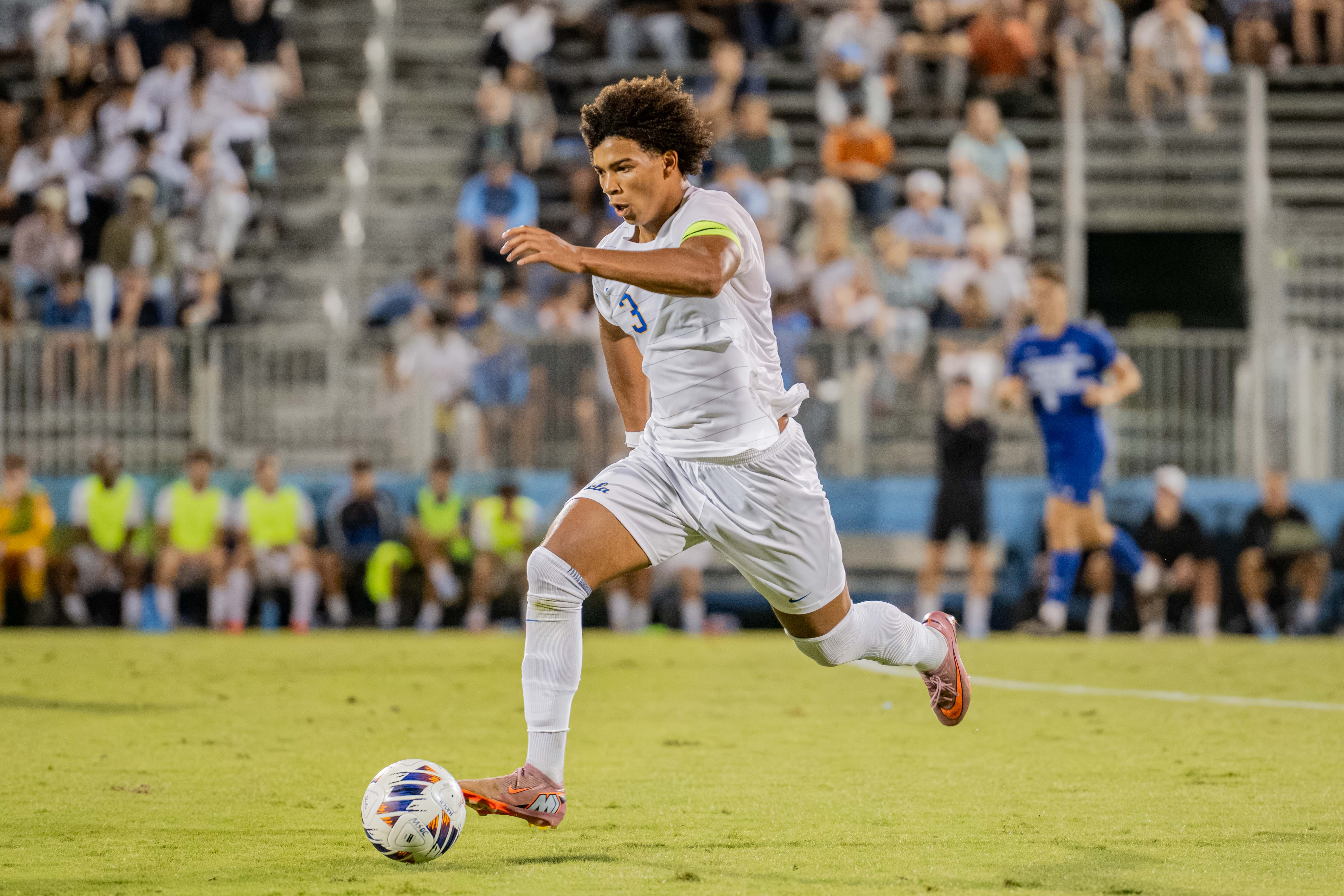 Senior defender Tre Wright dribbles the ball in UCLA men's soccer's game against Cal State Bakersfield on Monday. Wright was drafted 33rd overall in the 2026 MLS SuperDraft but decided to return to Westwood. (Amelia Chief/Daily Bruin senior staff)