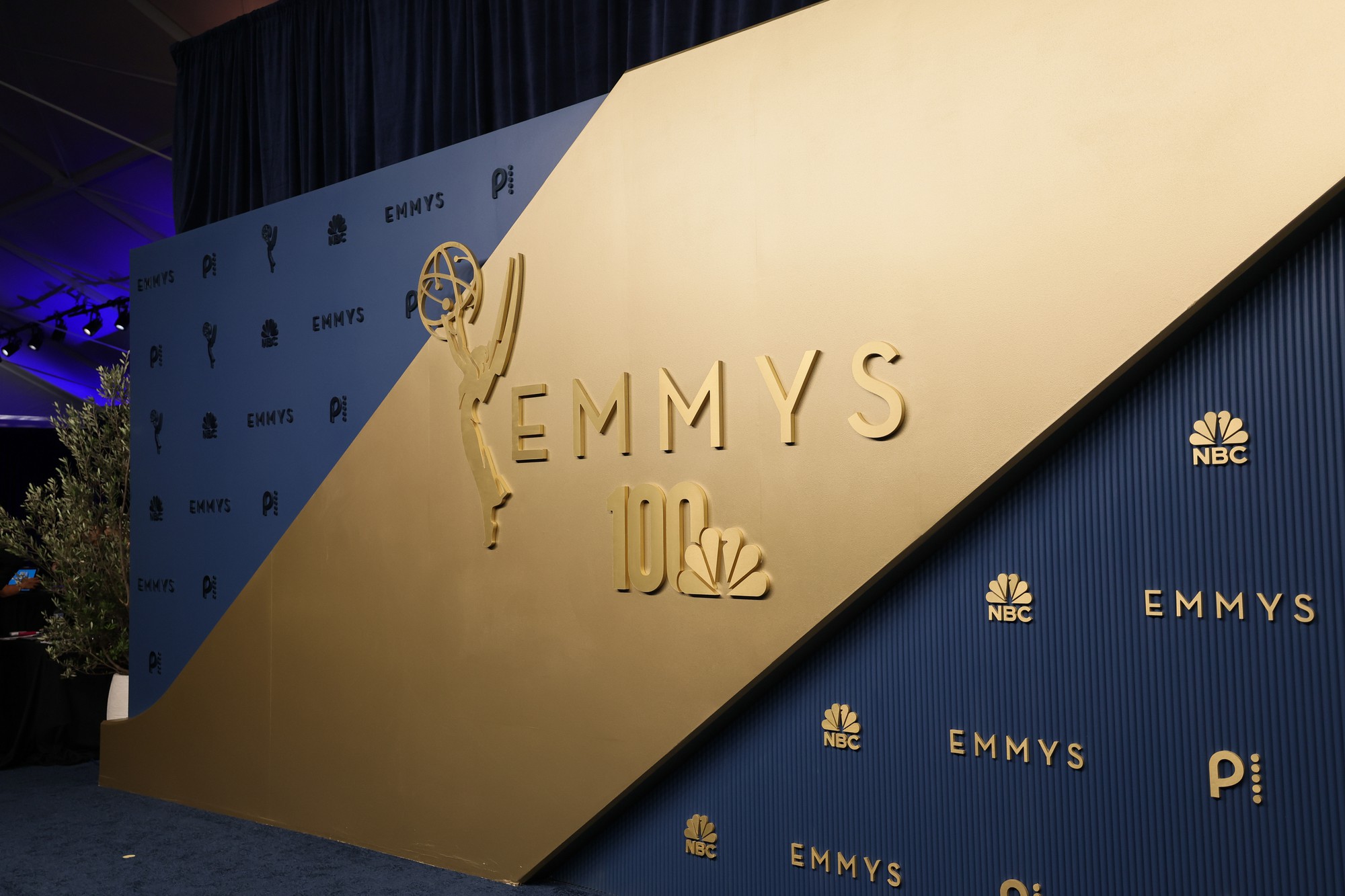 Pictured are the backdrop and carpet of the 2026 Primetime Emmy Awards, which swapped the red carpet for 'peacock blue' to mark NBC's 100th anniversary. The event was held at the Peacock Theater in Los Angeles. (Courtesy of Danny Moloshok/Invision for the Television Academy/AP Content Services)