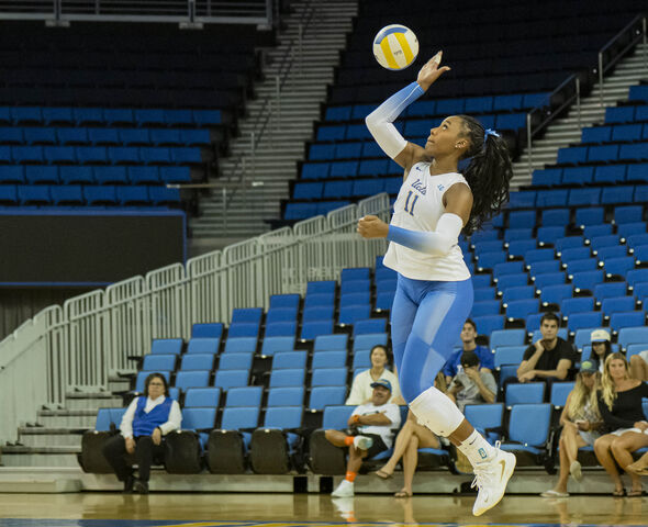 Fifth-year Marianna Singletary jumps to serve the ball. Singletary leads the team in kills and points with 81 and 112, respectively. (Amelia Chief/Daily Bruin senior staff)