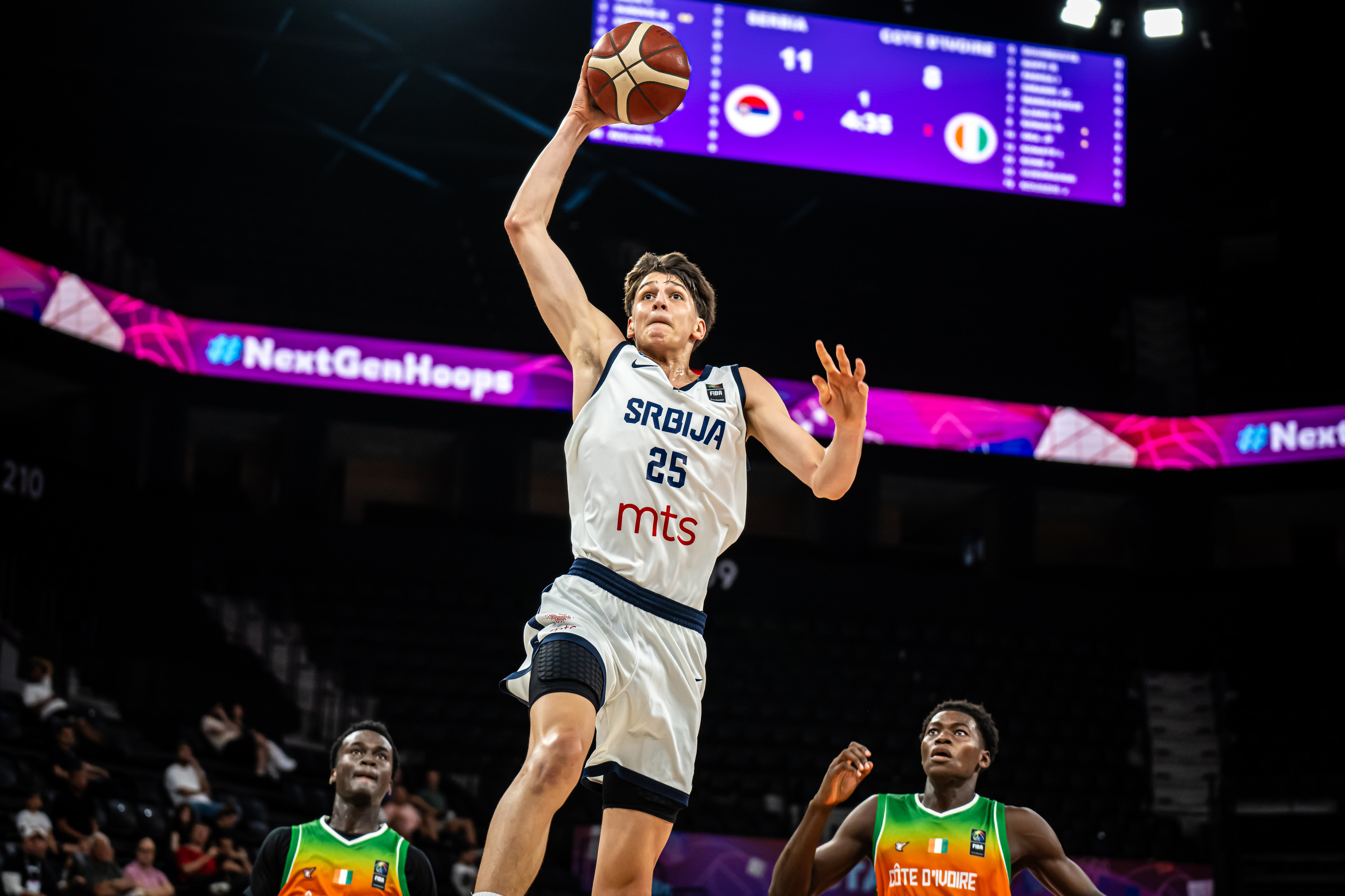 UCLA men's basketball freshman guard/forward Nikola Kusturica rises for a dunk in transition during a game. Kusturica has experience with FC Barcelona and the Serbian national team at the FIBA U17 World Cup. (Courtesy of FIBA)