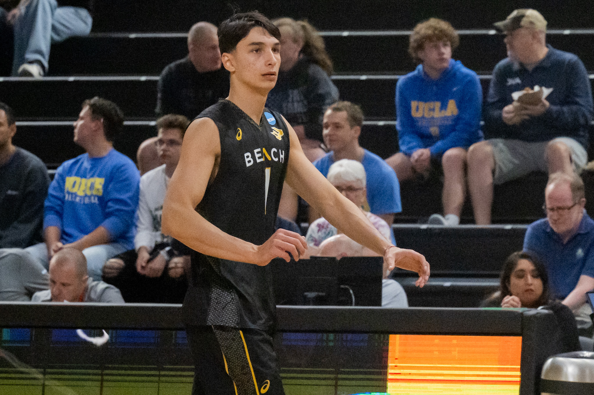 Former Long Beach State setter Moni Nikolov walks on the sideline during a game. Nikolov led Long Beach to a national title in 2025. (Daily Bruin file photo)