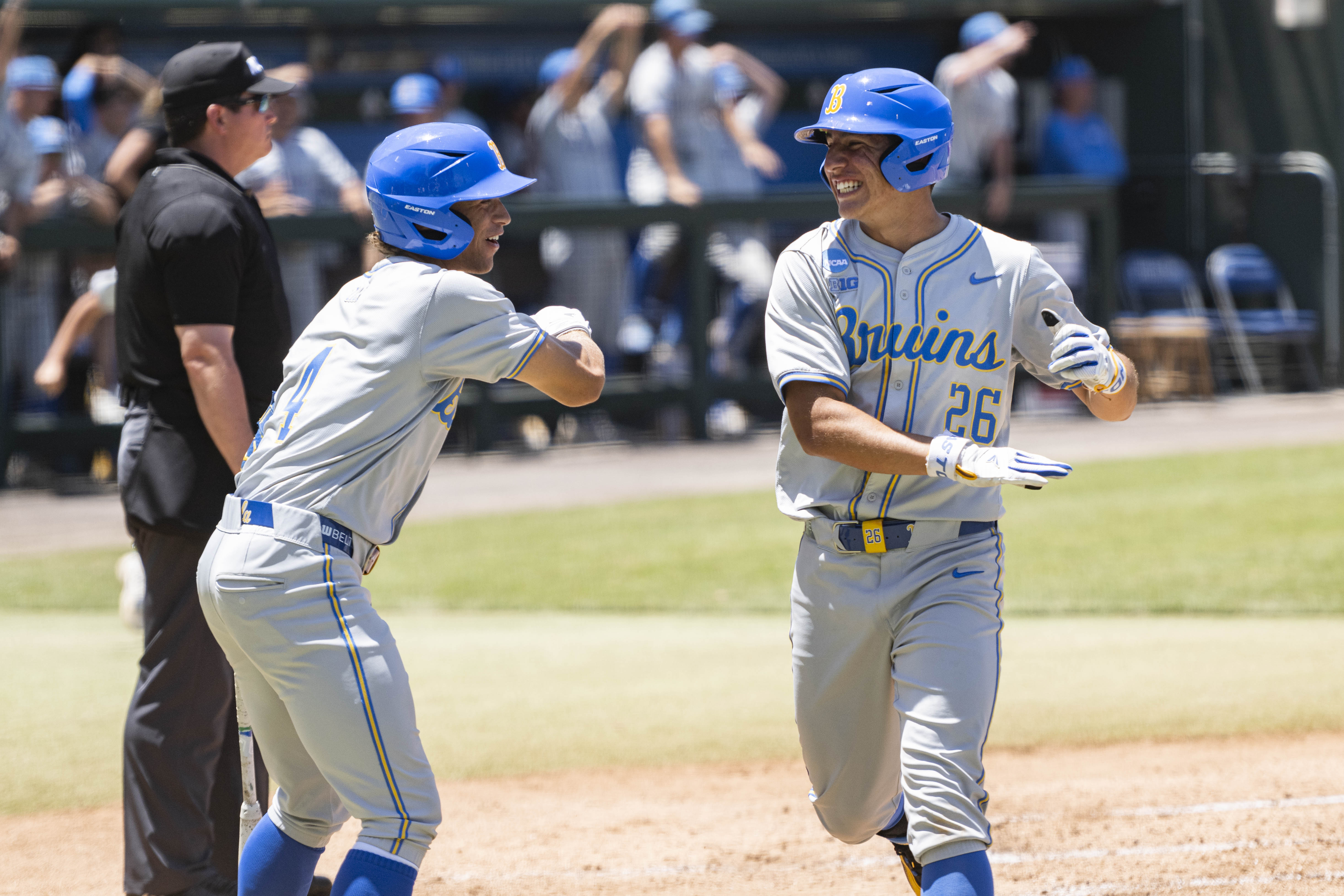 Senior utility Phoenix Call greets sophomore infielder Aiden Aguayo at the plate. (Kai Dizon/Assistant Photo editor)