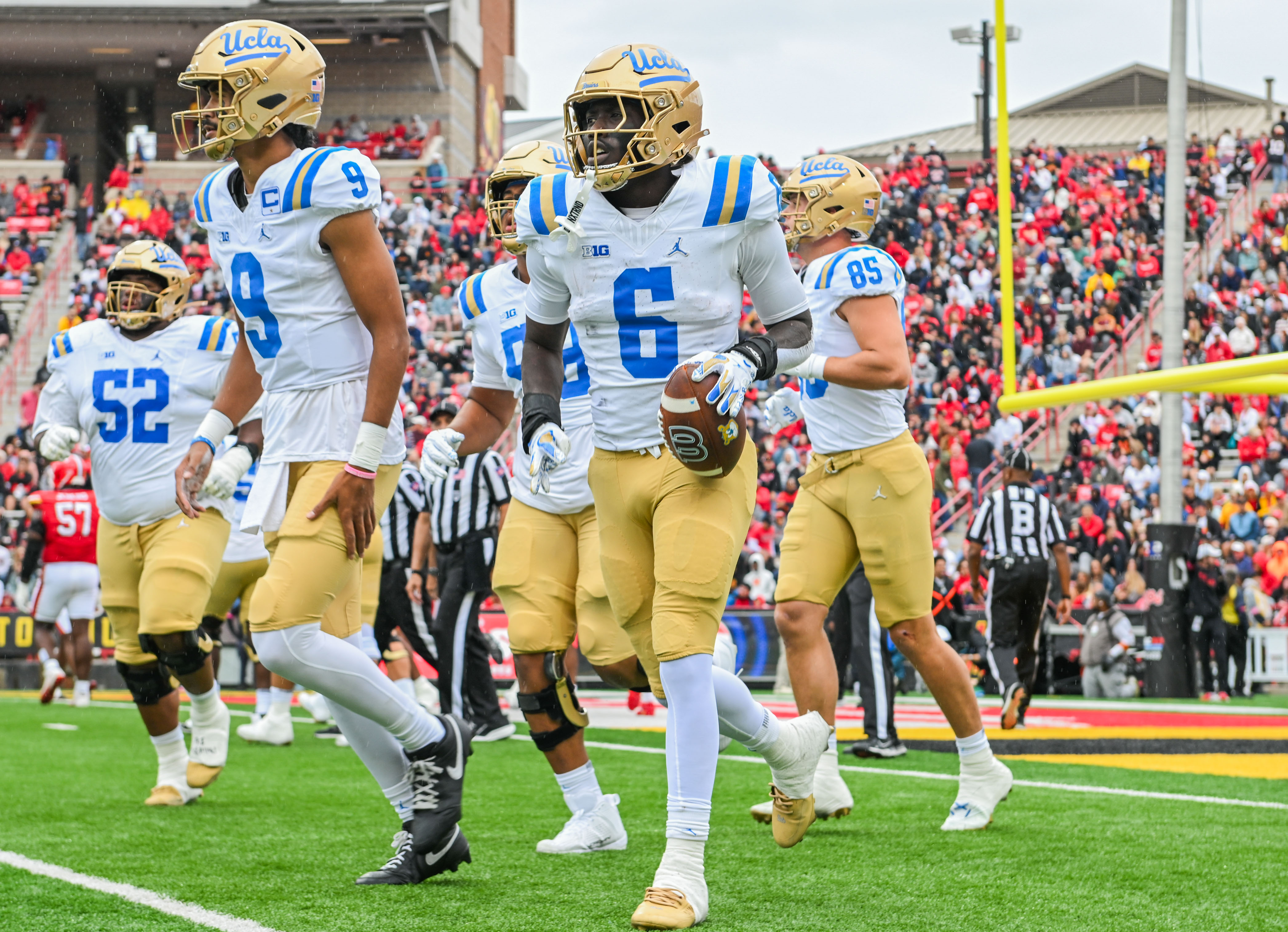 Fifth-year running back Anthony Woods holds the ball after scoring a touchdown. Woods rushed for one touchdown and 41 yards against Maryland.