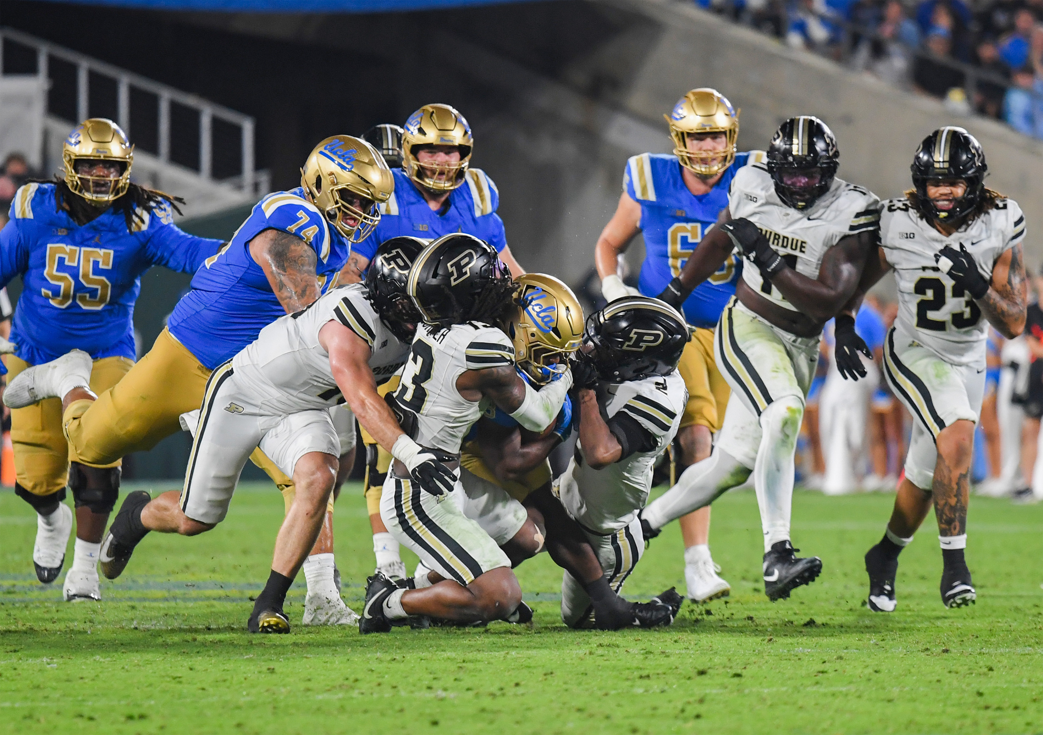 Knight plows into three Boilermakers. (Kai Dizon/Assistant Photo editor)