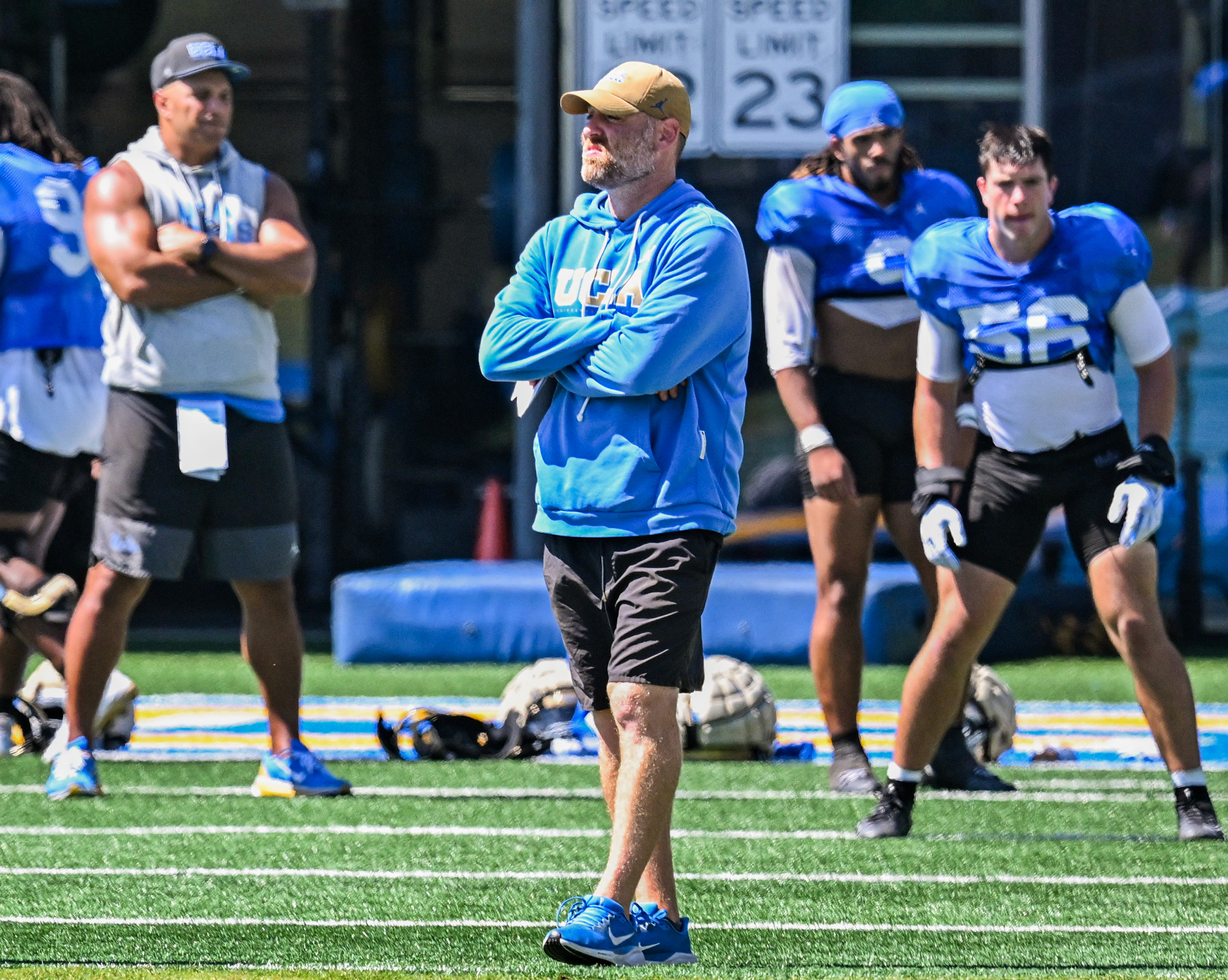 Defensive coordinator Colin Hitschler watches his unit practice Wednesday. (Kai Dizon/Assistant Photo editor)