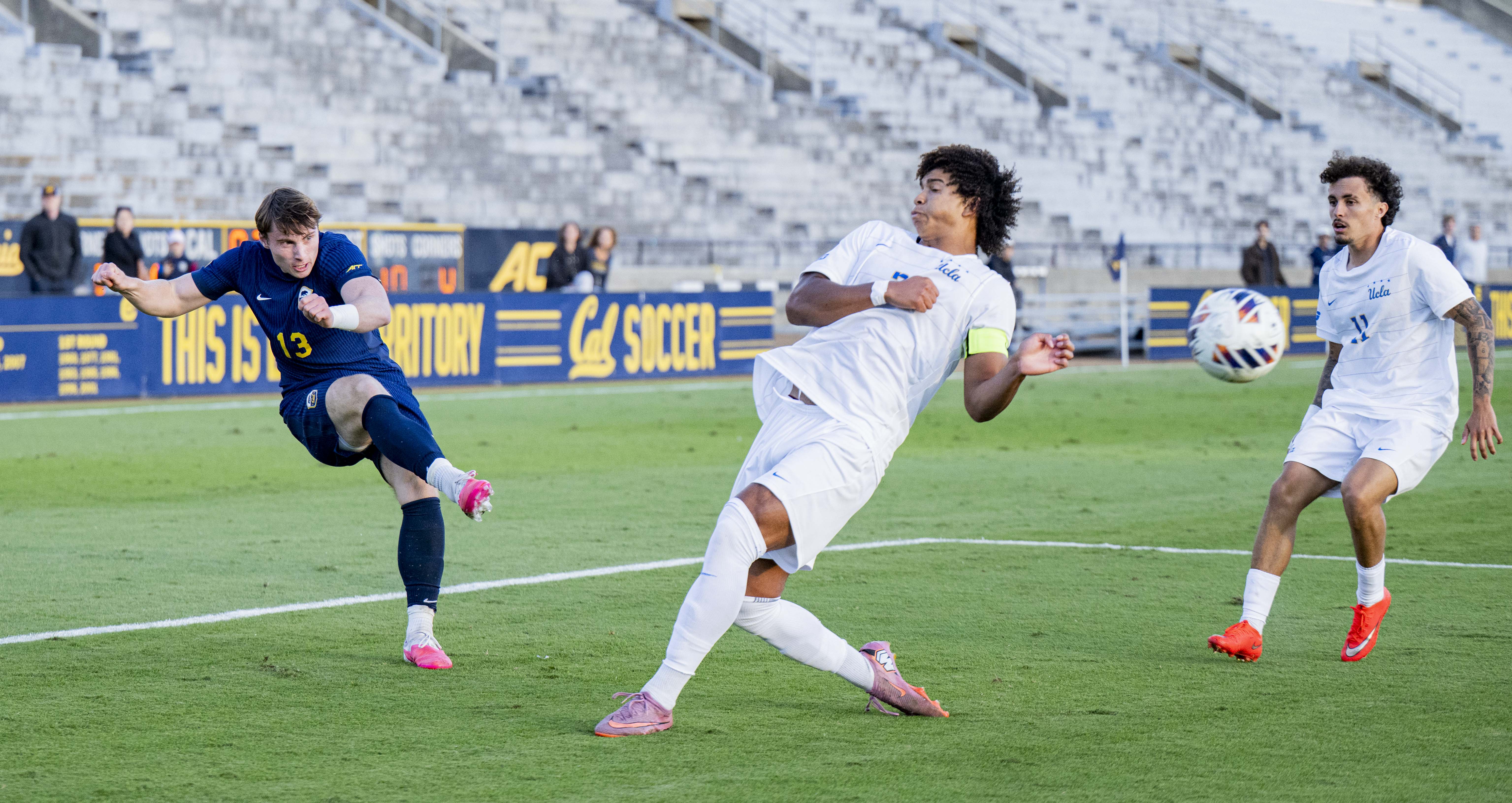 Senior defender Tre Wright (left) defends and junior defender David de la Vibora (right) runs after the ball in UCLA's 2-2 draw against California. Wright, the squad's captain, leads the team in minutes played. (Leydi Cris Cobo Cordon/Daily Bruin senior staff)