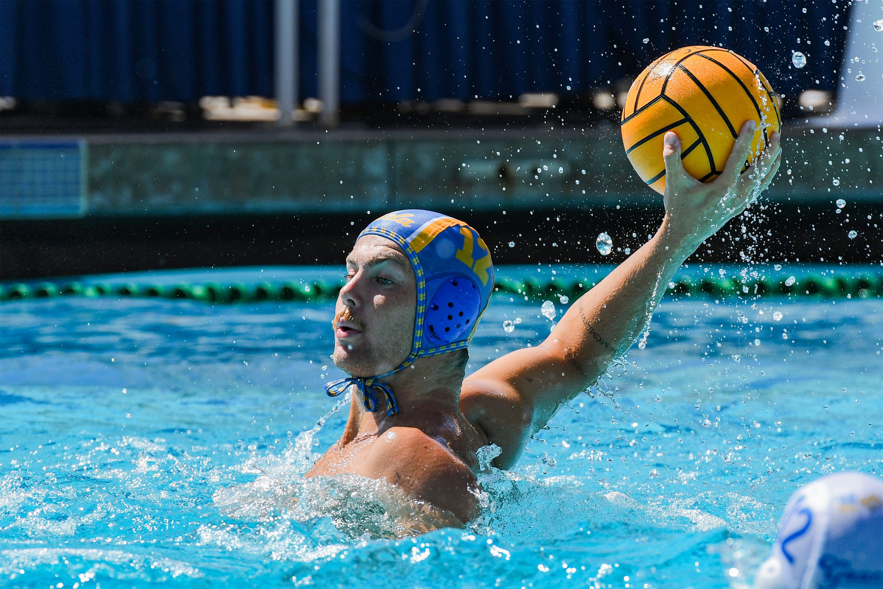 Junior attacker Bode Brinkema prepares to throw the ball. Brinkema has tallied 13 goals so far this season. (Elle Smith/Daily Bruin staff)