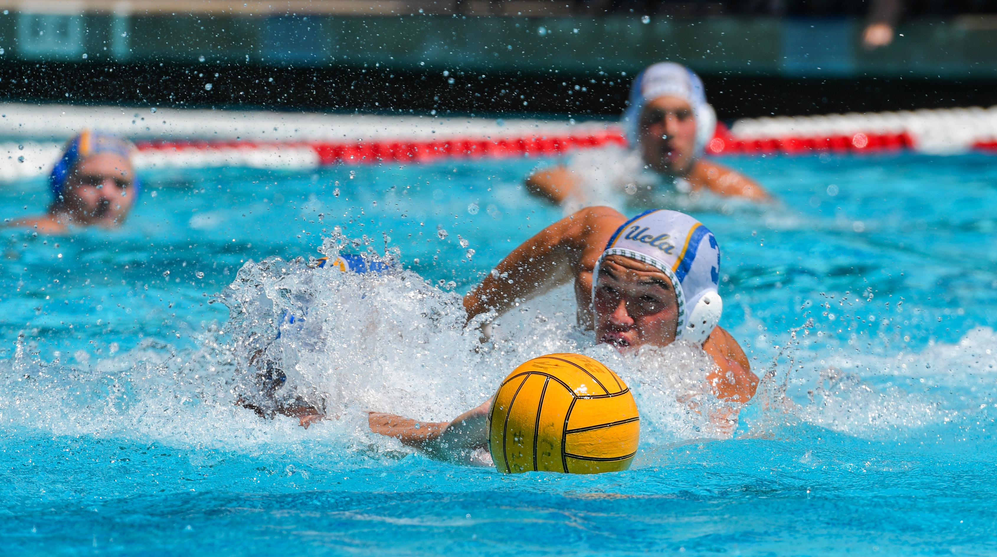 Fifth-year defender Jack Merrill swims after the ball.