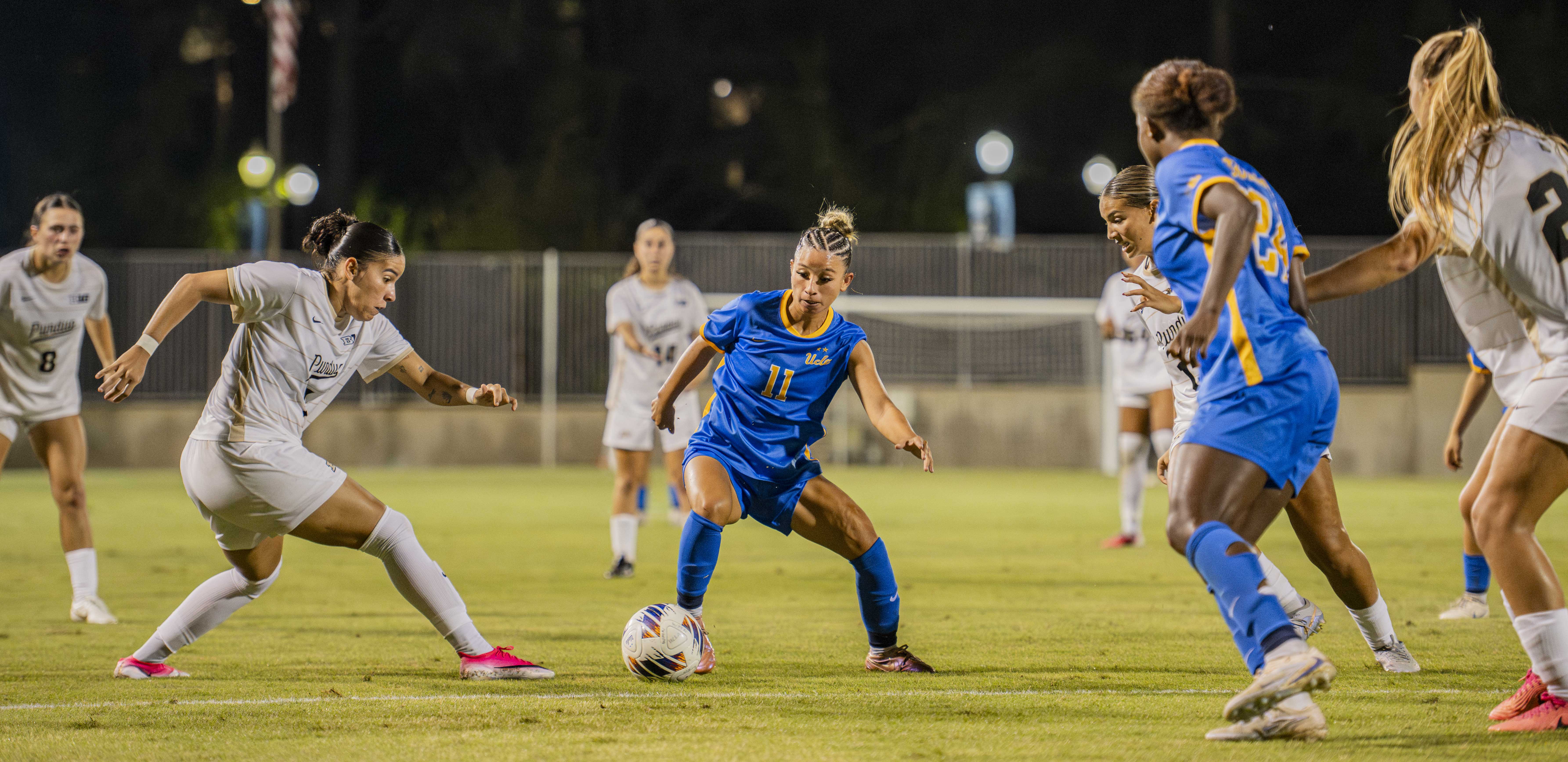 Senior midfielder Marli Galdamez dribbles past a Purdue defender. (Elle Smith/Daily Bruin staff)