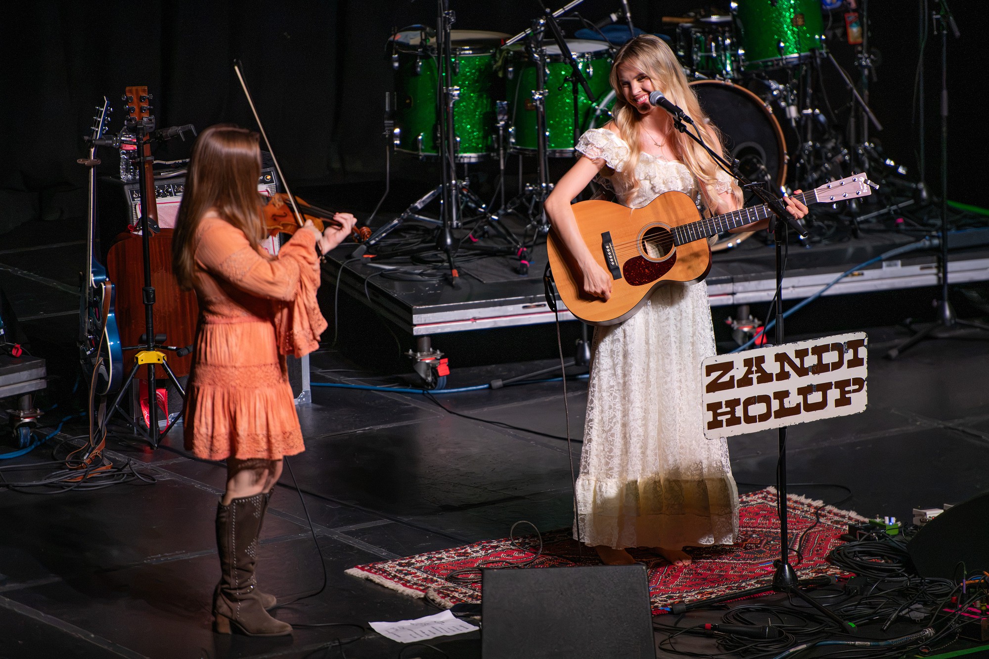 Opener Zandi Holup stands in a magnolia-white dress. The artist performed songs such as her soulful single, “Gas Station Flowers.”(Selin Filiz/Daily Bruin senior staff)