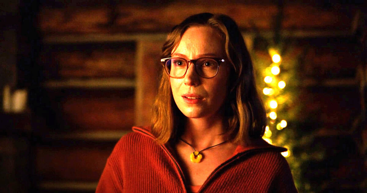 Einbinder stares forward while wearing glasses and a necklace. Schoenbrun’s film stars Einbinder as Kris, a young director tasked with reviving the aging Camp Miasma horror franchise. (Courtesy of IMDb)