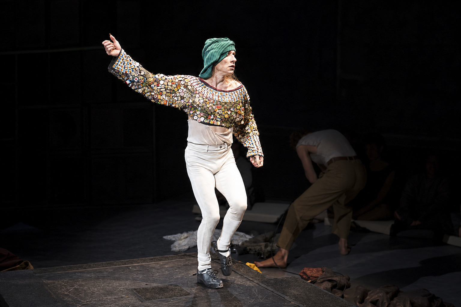 Chaignaud stands on stage in white pants and a patterned top. The graduate of Paris’ National Superior Conservatory for Music and Dance creates work that intertwines dance, singing, and history. (Courtesy of Chanel Foster)