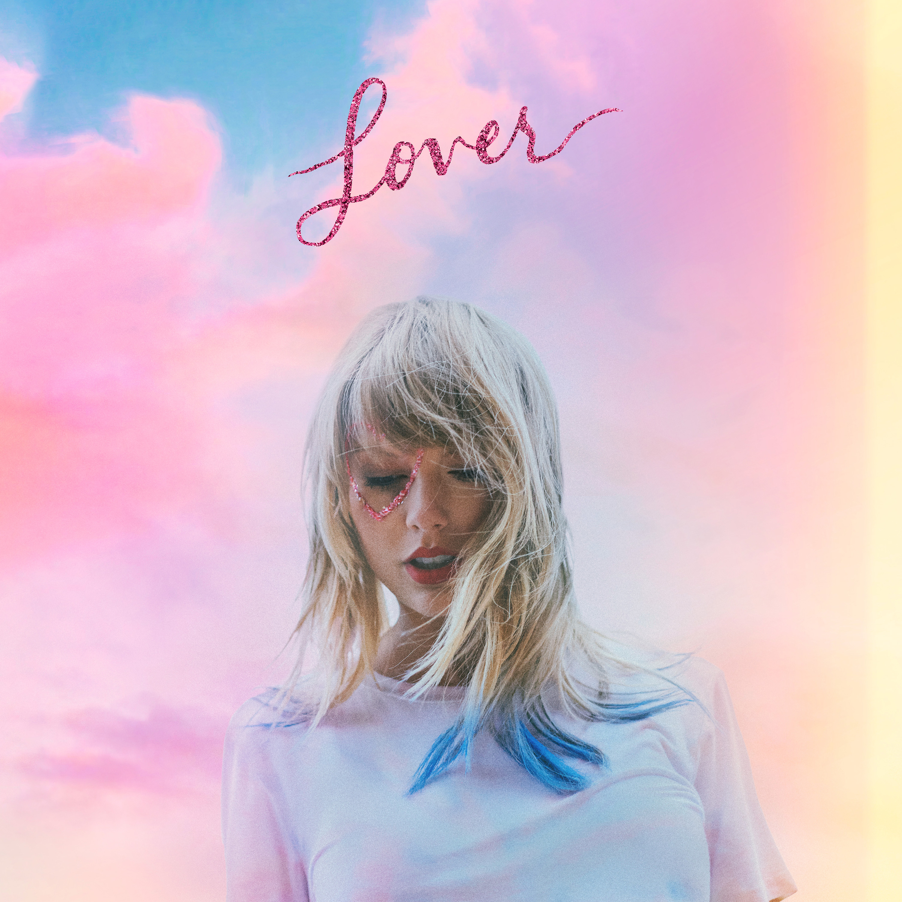 Swift wears a tie-dye shirt against a sunset-like background on the cover of her seventh studio album, “Lover.”(Courtesy of 2019 Taylor Swift)