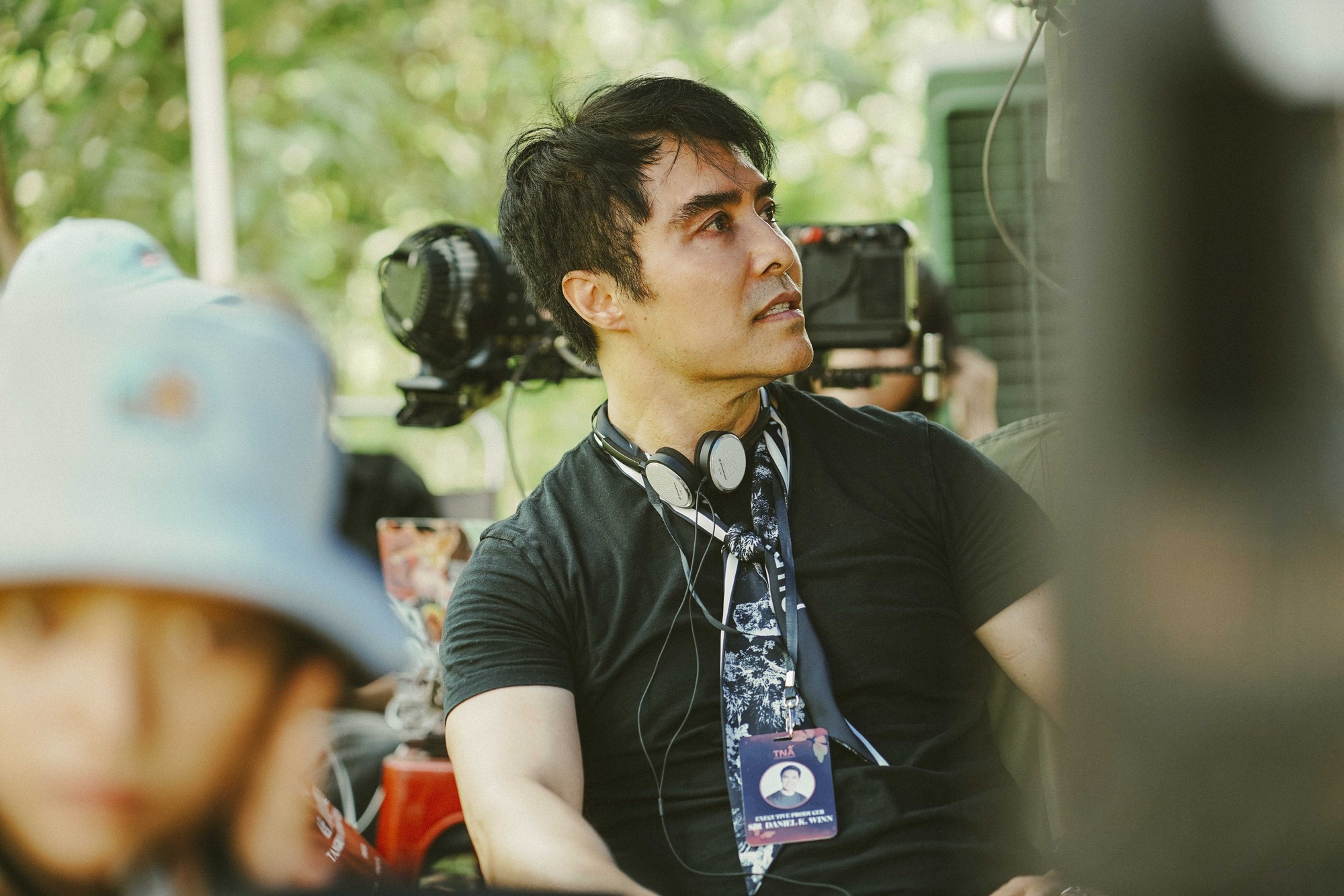 Daniel K. Winn wears headphones and a black shirt while on set. Winn said working on the film based on his life was cathartic. (Courtesy of WS Productions)