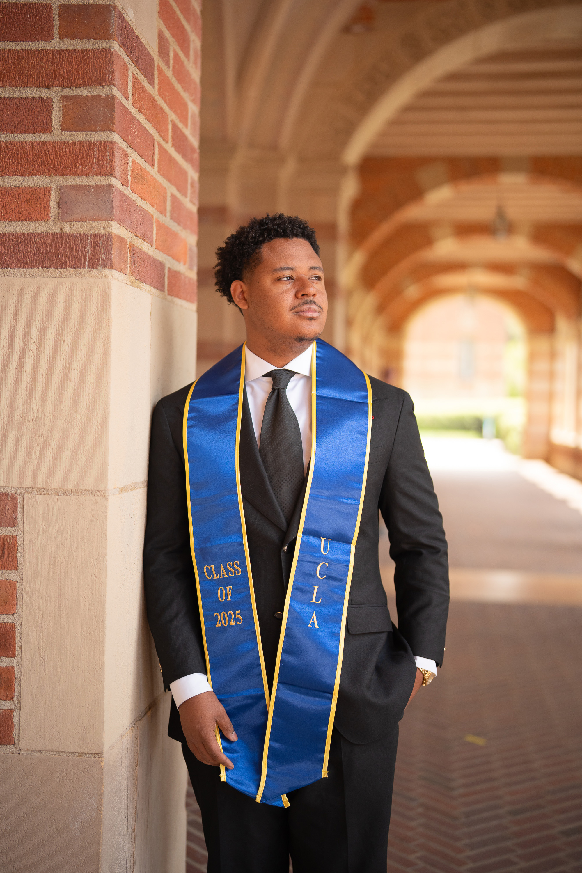 Derrick Williams poses outside of Royce Hall wearing a graduation stole. Williams graduated from UCLA in 2025 and is now a student at Texas Southern University's Thurgood Marshall School of Law. (Courtesy of Derrick Williams)