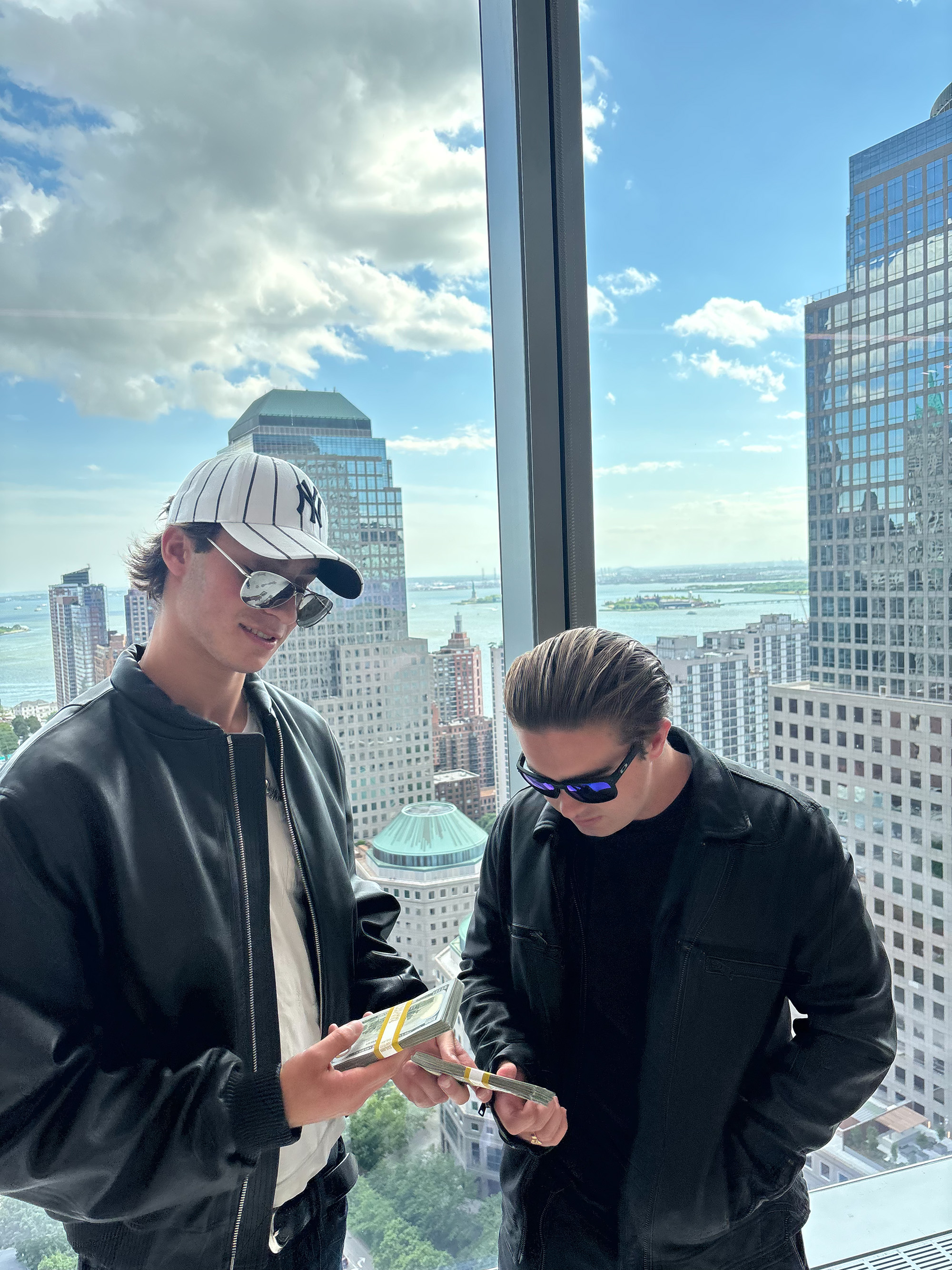Harwin and Schwartz sport shades in front of a city skyline. MyPlots has hosted events with artists including Playboi Carti, Don Toliver, Nettspend and Gunna. (Courtesy of Jack Schwartz)