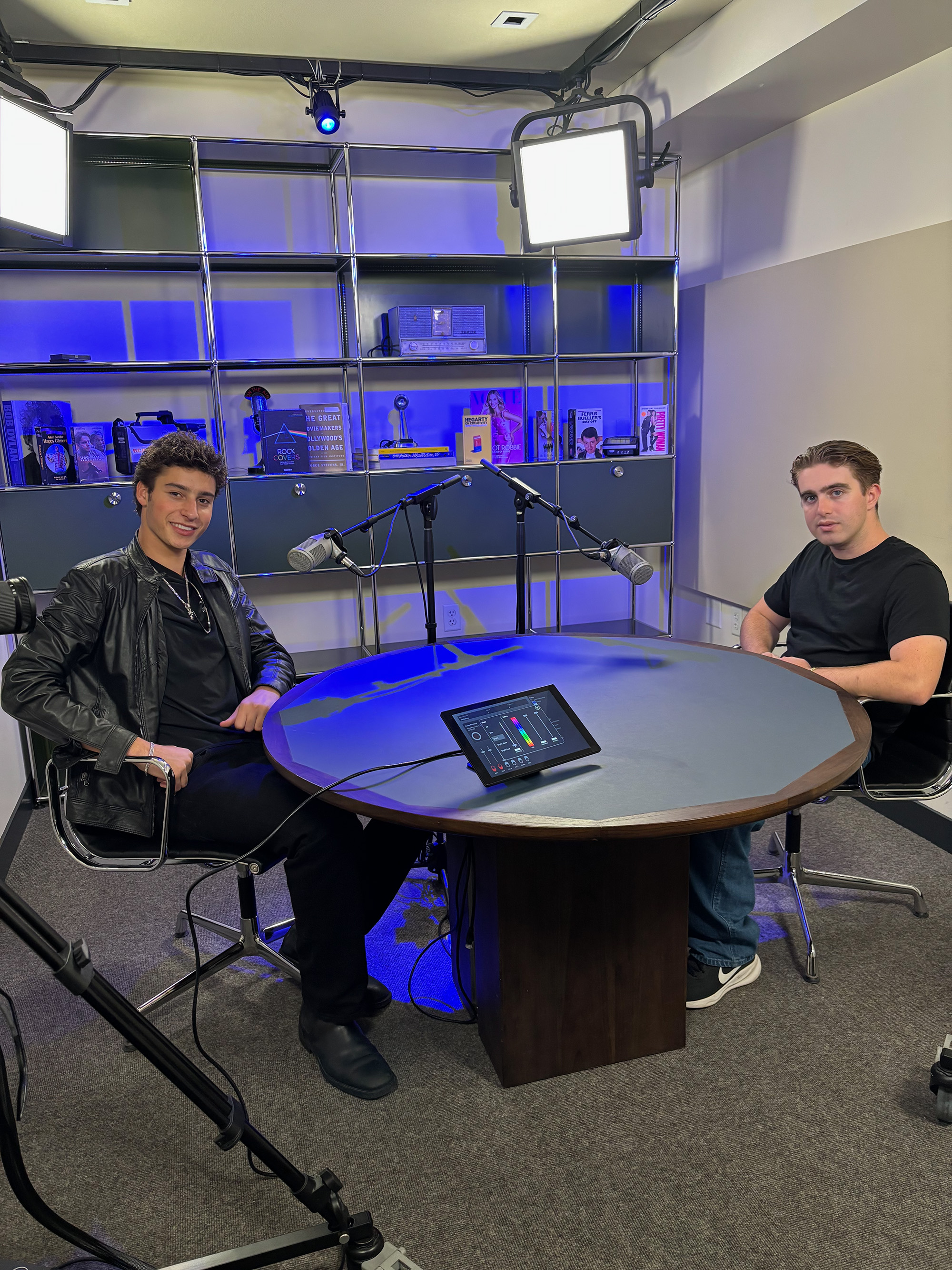 Harwin and Schwartz are pictured behind microphones. Schwartz said his experience organizing events dates back to his junior year of high school, when he began throwing parties and later branded these efforts under the MyPlots name. (Courtesy of Jack Schwartz)