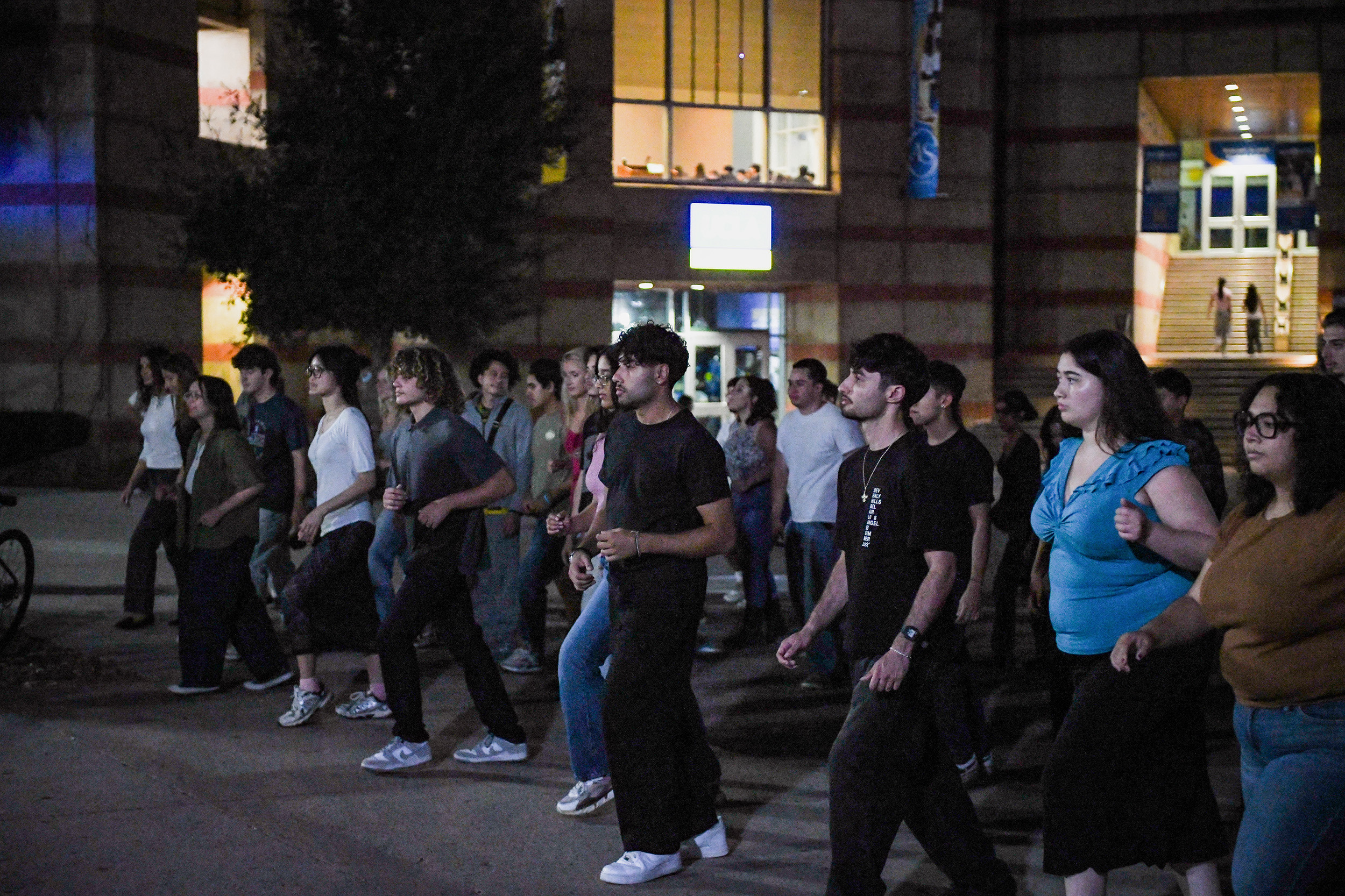 Members of the Salsa Society are pictured learning beginner-friendly steps. Salsa dancing is an energetic, improvised dance style rooted in Latin American culture that involves dancing with a partner over an eight-count beat. (Aiden Martinez/Daily Bruin)