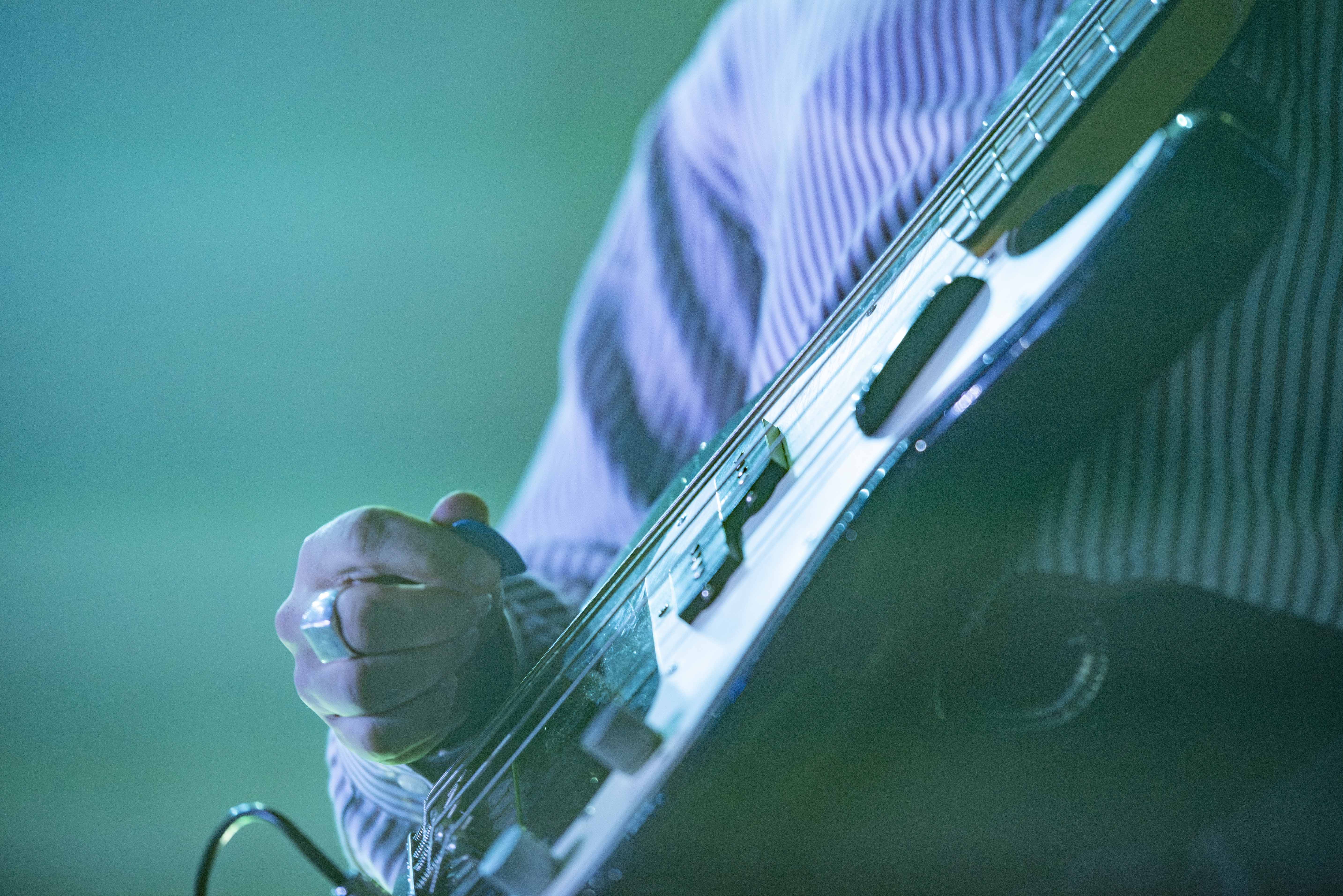 Fabry holds a guitar pick in his right hand. The band performed songs such from its most recent album and its 2024 debut record “DIVE.” (Joice Ngo/Assistant Photo editor)