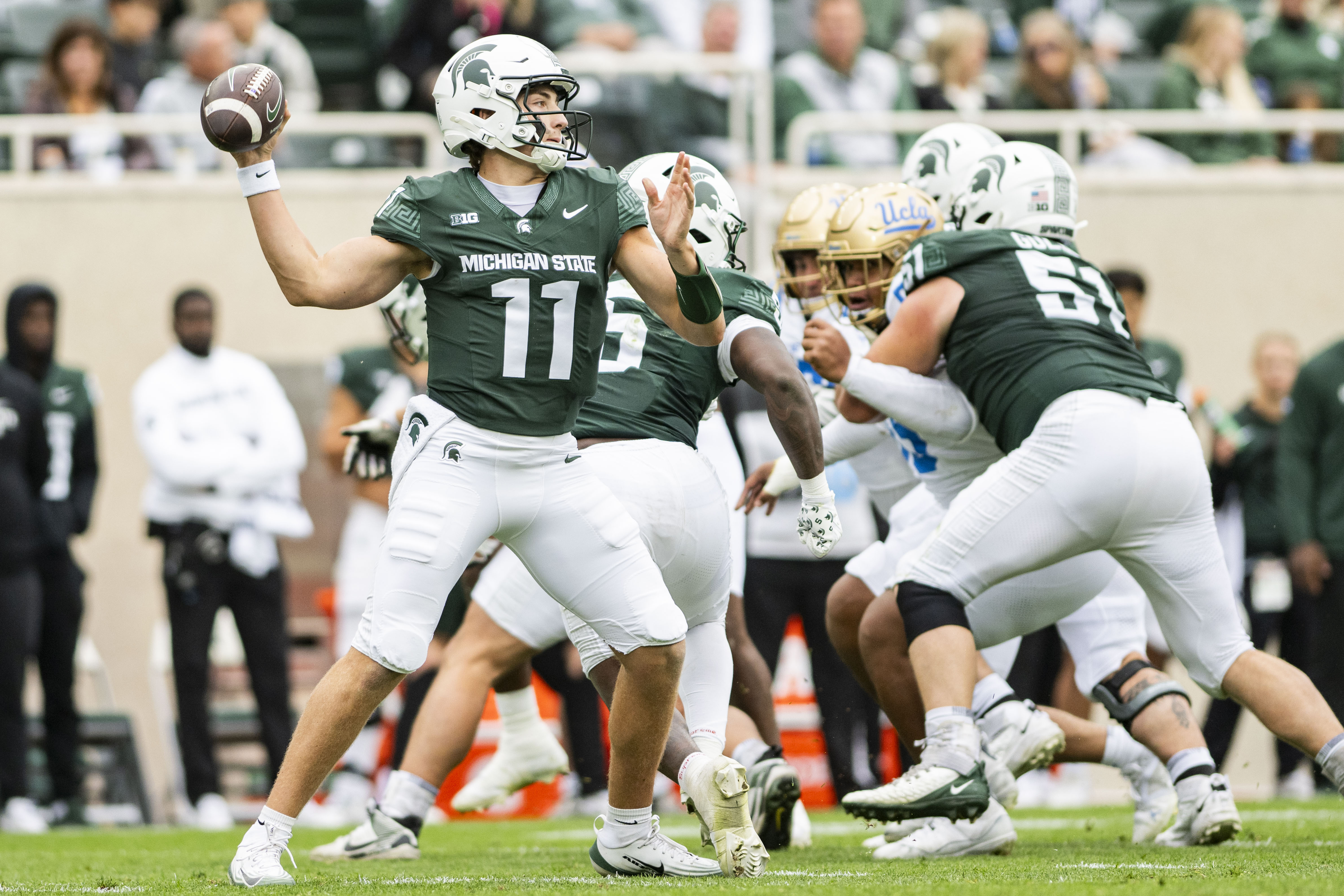 Michigan State quarterback Alessio Milivojevic reaches back to pass during the team's game against UCLA in East Lansing last season. (Daily Bruin file photo)