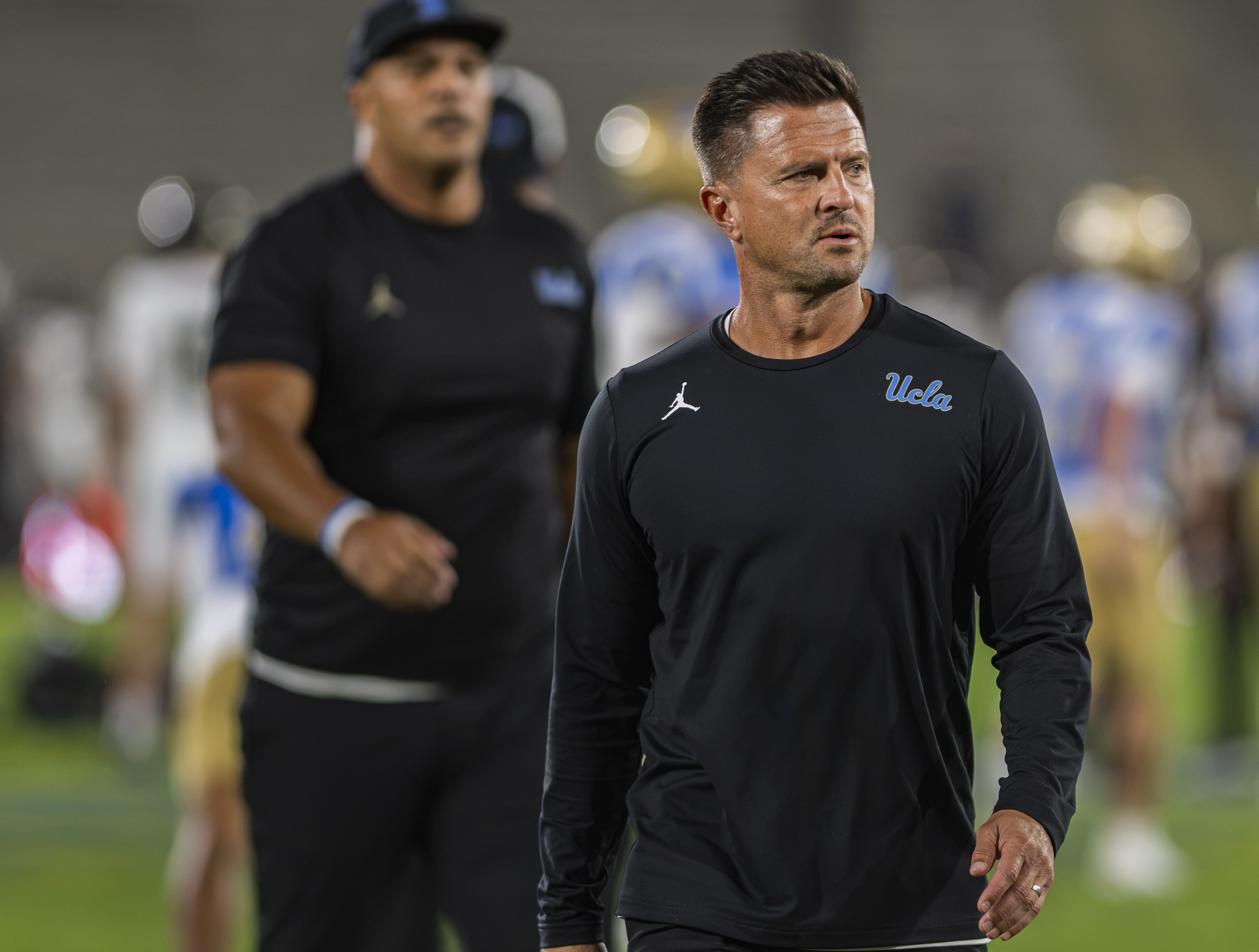 Coach Bob Chesney stands on the field during UCLA's game against Purdue on Sept. 19. Chesney last coached against the Ducks in the first round of the 2025 College Football Playoffs. (Chenrui Zhang/Daily Bruin staff)