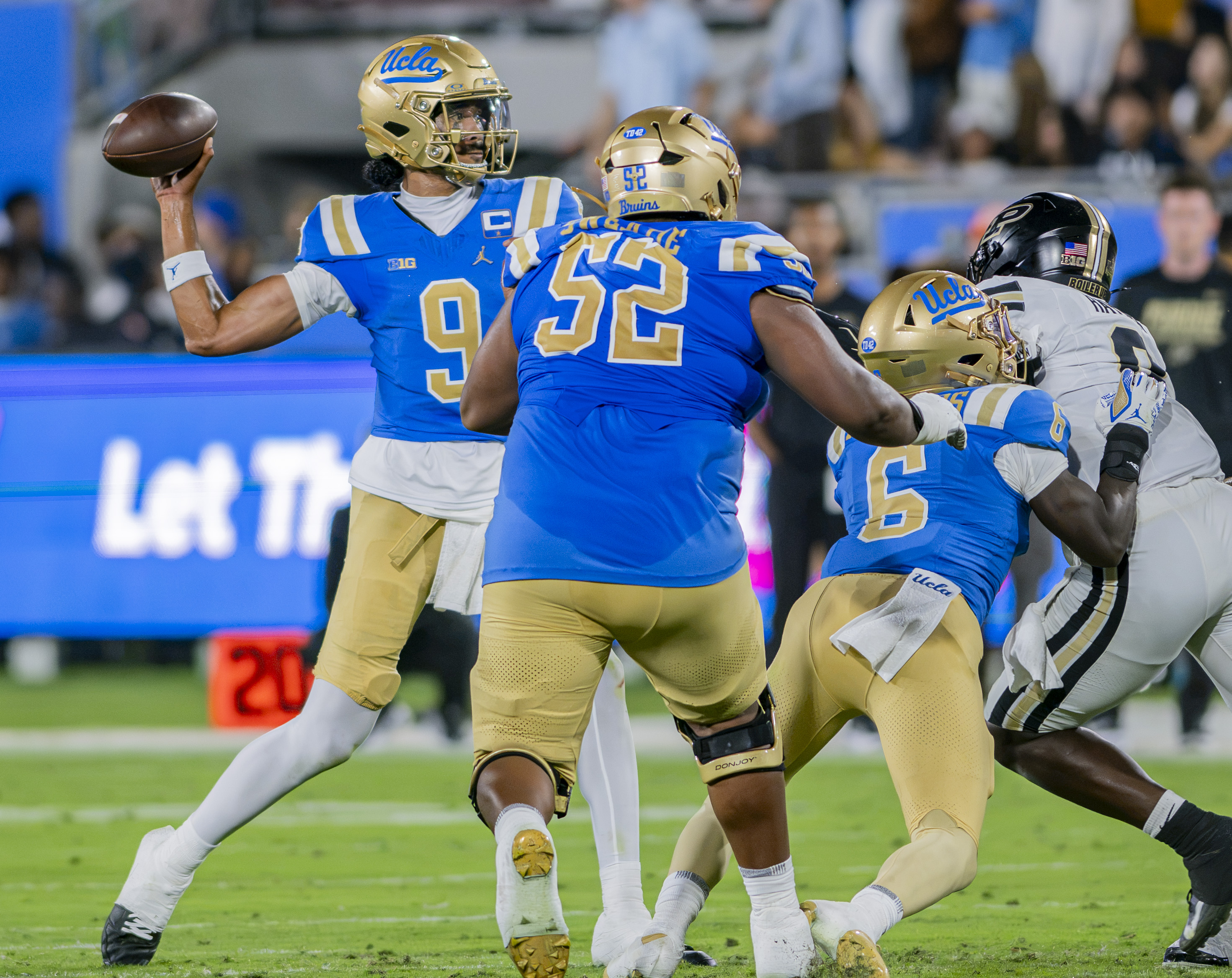 Senior quarterback Nico Iamaleava brings his arm back for a throw against Purdue. Iamaleava has thrown for four touchdowns and two interceptions this season. (Chenrui Zhang/Daily Bruin staff)