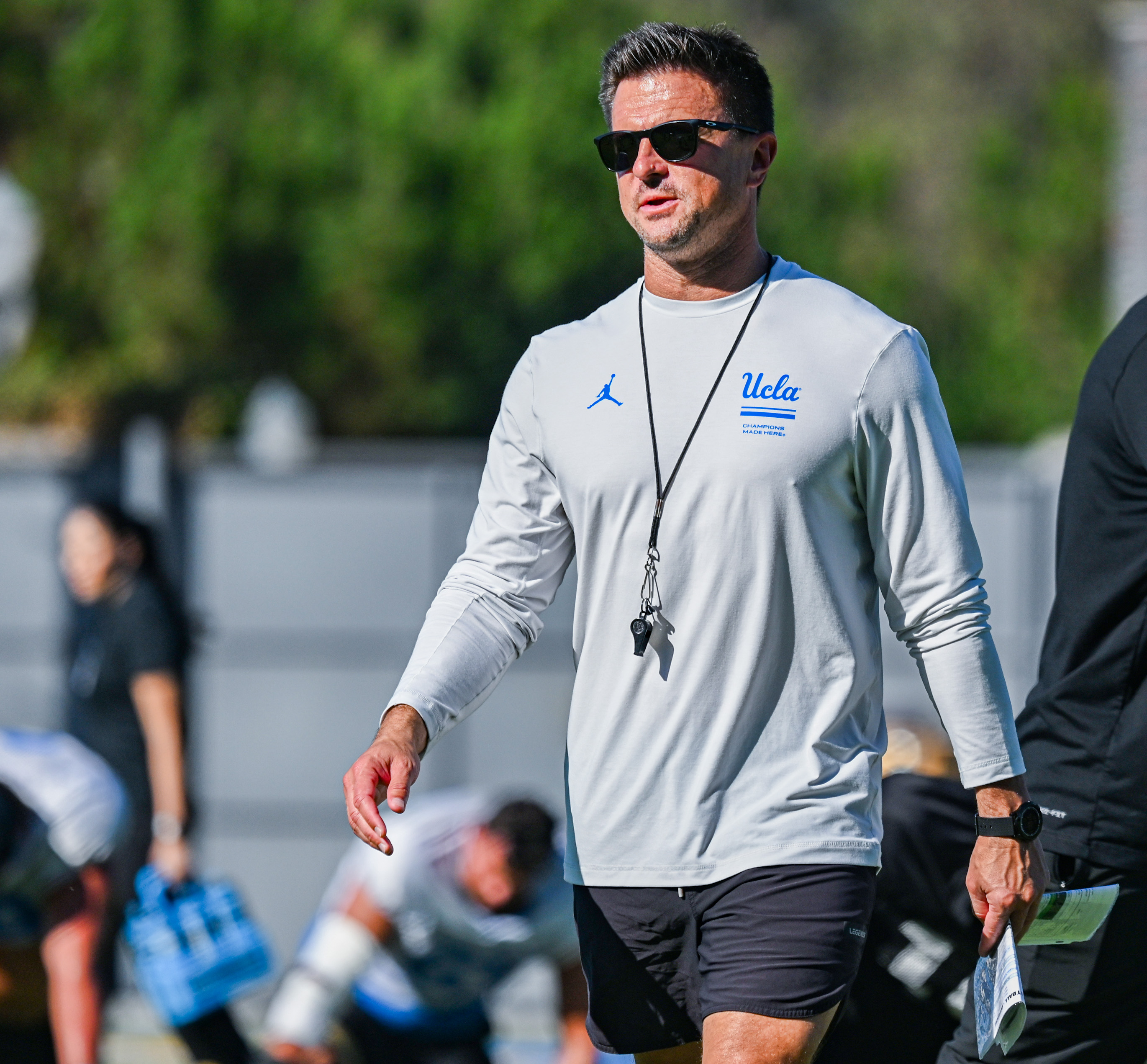 Coach Bob Chesney walks on the field during his team's practice. Chesney last coached against Oregon with James Madison. (Kai Dizon/Assistant Photo editor)