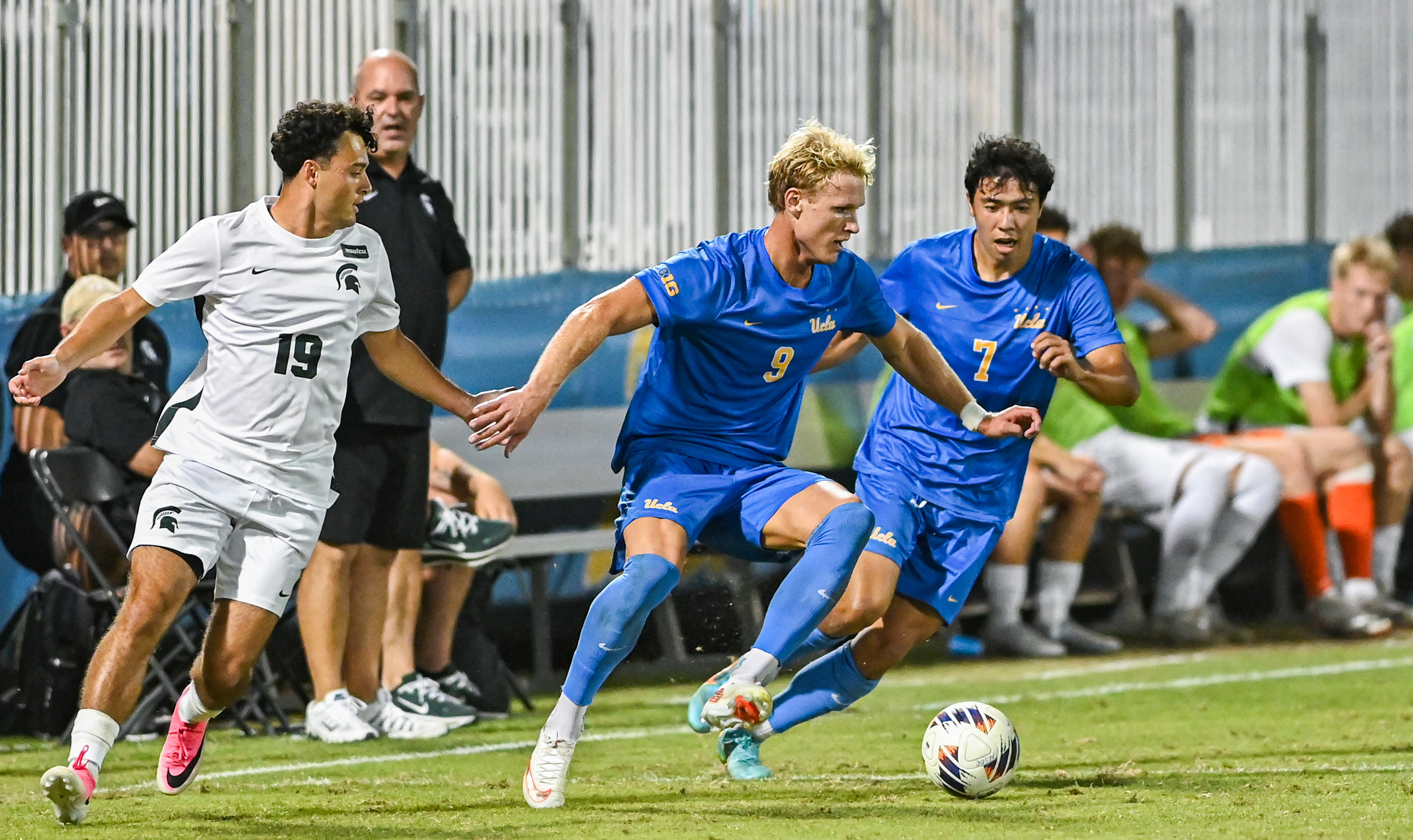 Senior forward Oliver Roche takes a touch away from a defender as senior midfielder Philip Naef trails behind him. Roche recorded his first goal of the 2026 season in a 3-0 win over Michigan State. (Elle Smith/Daily Bruin staff)