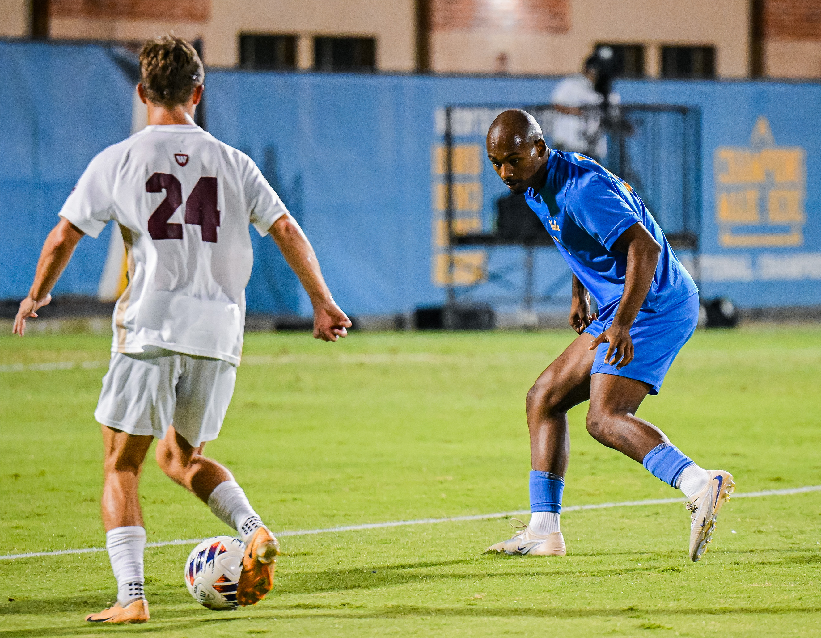 Freshman defender Marcus Jackson readies to defend against a Westmont player. Jackson recorded 58 minutes of play in the Bruins' 5-1 win over the Warriors. (Miles Turner/Daily Bruin)