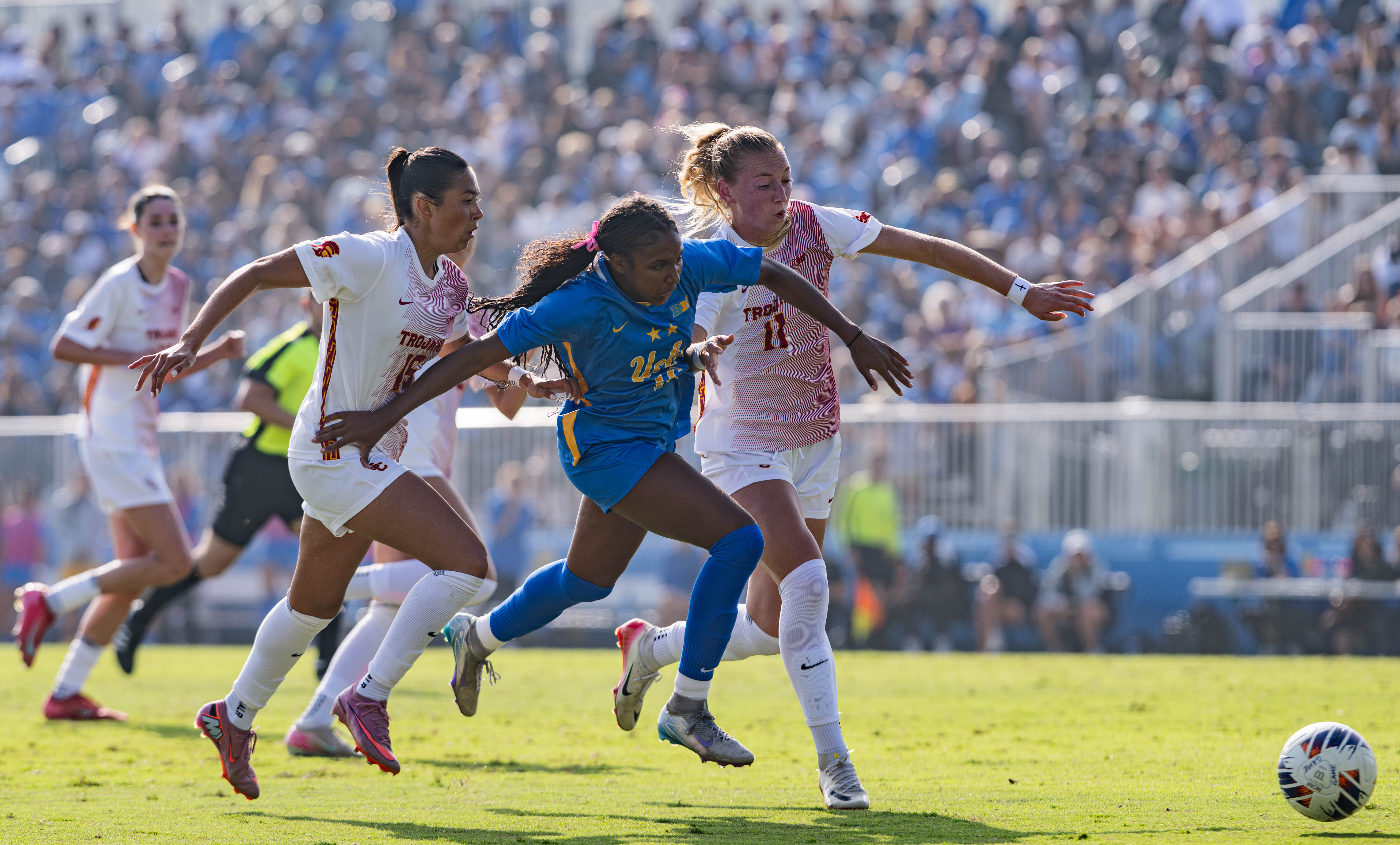 Sophomore forward Leena Powell breaks past two Trojan defenders on a breakaway during last season’s game against USC. (Daily Bruin file photo)