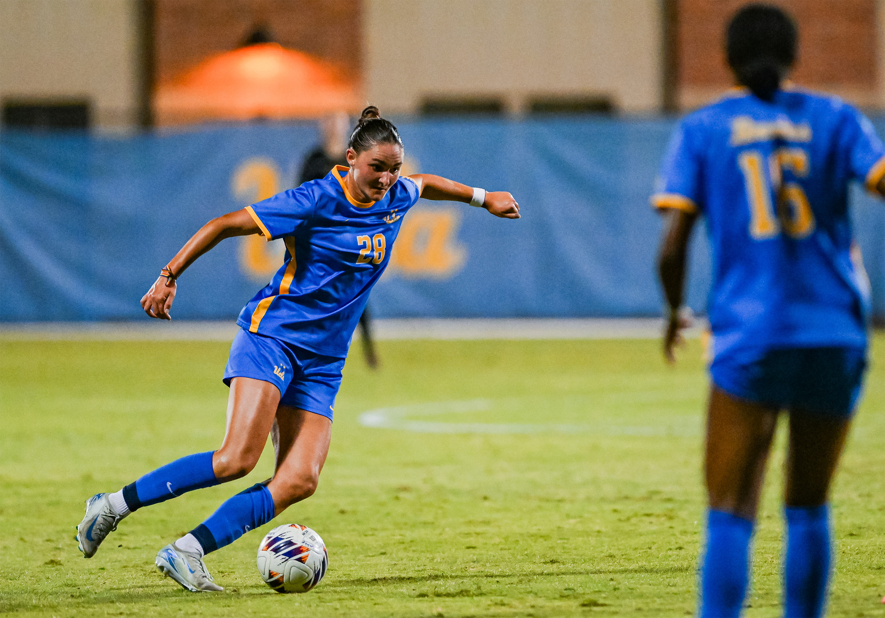 Freshman defender Anna Wilson dribbles the ball. Wilson scored her second goal as a Bruin on Sunday. (Bettina Wu/Daily Bruin senior staff)